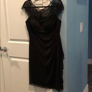 black dress with illusion neckline with beading